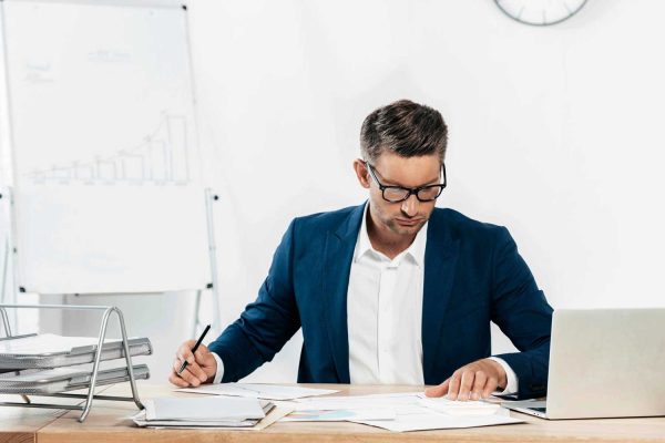 medium-shot-man-using-calculator_11zon