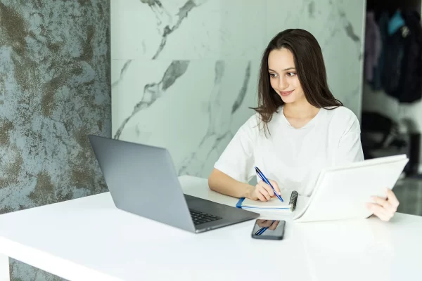 thoughtful-young-woman-thinking-using-business-vision-near-calculator-laptop-calculating-finance-rates-looking-future-min